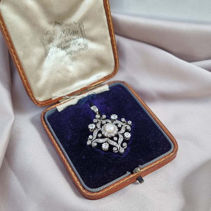 Victorian Antique Natural Pearl and Diamond Pendant come Brooch, central natural pearl surrounded by sparkling diamond in floral cluster design Presented in antique fitted box.