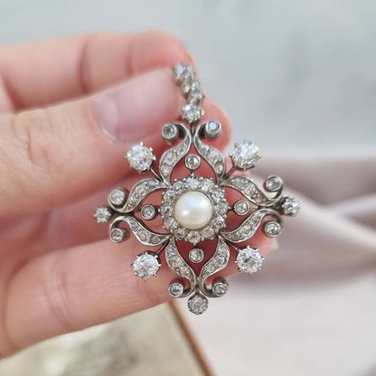 Victorian Antique Natural Pearl and Diamond Pendant come Brooch, central natural pearl surrounded by sparkling diamond in floral cluster design Presented in antique fitted box.