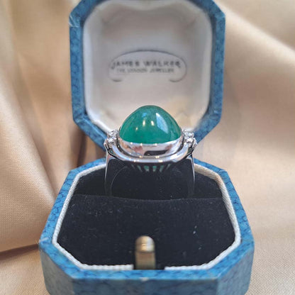 9ct Cabochon Emerald Ring with Diamonds, large 9.89ct cabochon-cut emerald set in 18ct white gold accented with sparkling diamonds to each side