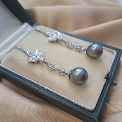 Grey Pearl and Diamond Drop Earrings, grey pearls with silver undertones suspended from diamond drops to diamond-set fleur-de-lis tops in 18ct white gold