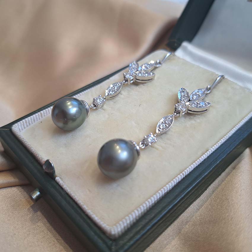 Grey Pearl and Diamond Drop Earrings, grey pearls with silver undertones suspended from diamond drops to diamond-set fleur-de-lis tops in 18ct white gold