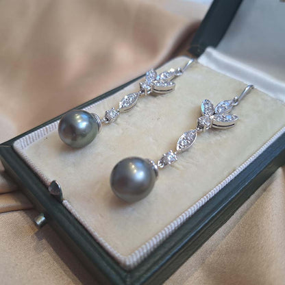 Grey Pearl and Diamond Drop Earrings, grey pearls with silver undertones suspended from diamond drops to diamond-set fleur-de-lis tops in 18ct white gold