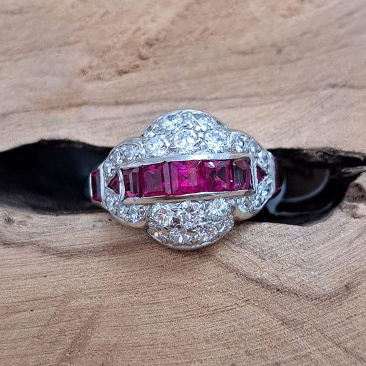 Art Deco Burma Ruby and Diamond Cluster Dress Ring, line of square rubies surrounded by pave old European transitional cut diamonds in platinum. Circa 1925