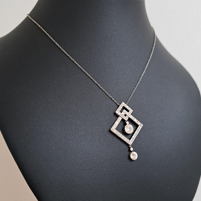 Art Deco 3.5ct Old Cut Diamond Pendant in Platinum, 3.50 carats of old European transitional cut diamonds set in entwined oblique squares. Circa 1920s