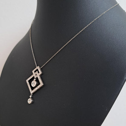 Art Deco 3.5ct Old Cut Diamond Pendant in Platinum, 3.50 carats of old European transitional cut diamonds set in entwined oblique squares. Circa 1920s