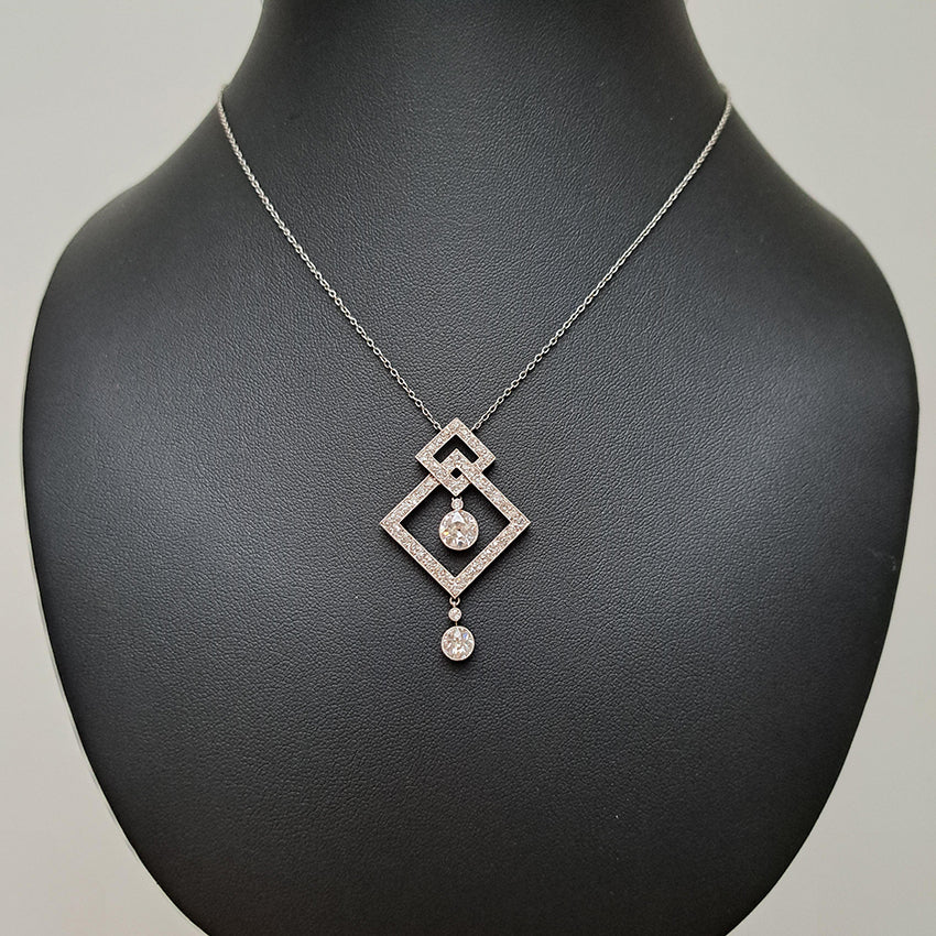 Art Deco 3.5ct Old Cut Diamond Pendant in Platinum, 3.50 carats of old European transitional cut diamonds set in entwined oblique squares. Circa 1920s