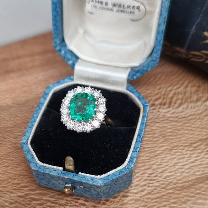 Vintage 2ct Emerald and Diamond Cluster Engagement Ring, 2ct cushion-cut emerald surrounded by 0.84cts round brilliant-cut diamonds in 18ct gold