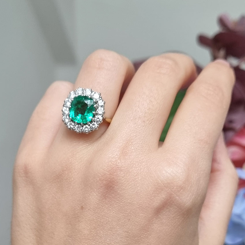 Vintage 2ct Emerald and Diamond Cluster Engagement Ring, 2ct cushion-cut emerald surrounded by 0.84cts round brilliant-cut diamonds in 18ct gold
