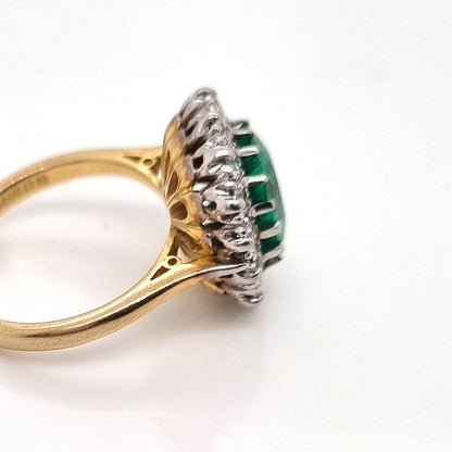 Vintage 2ct Emerald and Diamond Cluster Engagement Ring, 2ct cushion-cut emerald surrounded by 0.84cts round brilliant-cut diamonds in 18ct gold