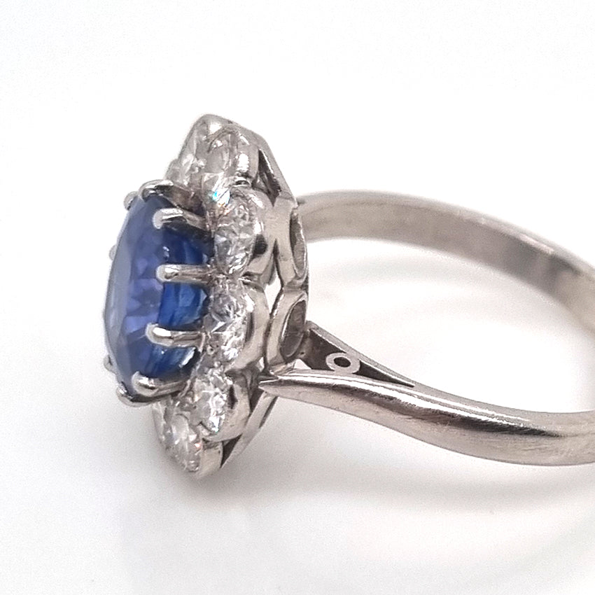 Vintage 2ct Cornflower Blue Sapphire and Diamond Flower Cluster Engagement Ring in Platinum