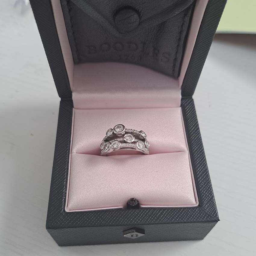 Boodles Waterfall Diamond Ring Classic Platinum, Inspired by the Raindance ring, the Waterfall ring features the iconic arrangement of diamond 'droplets' in an asymmetrical design over three bands which are then further accented with being set with smaller diamonds throughout