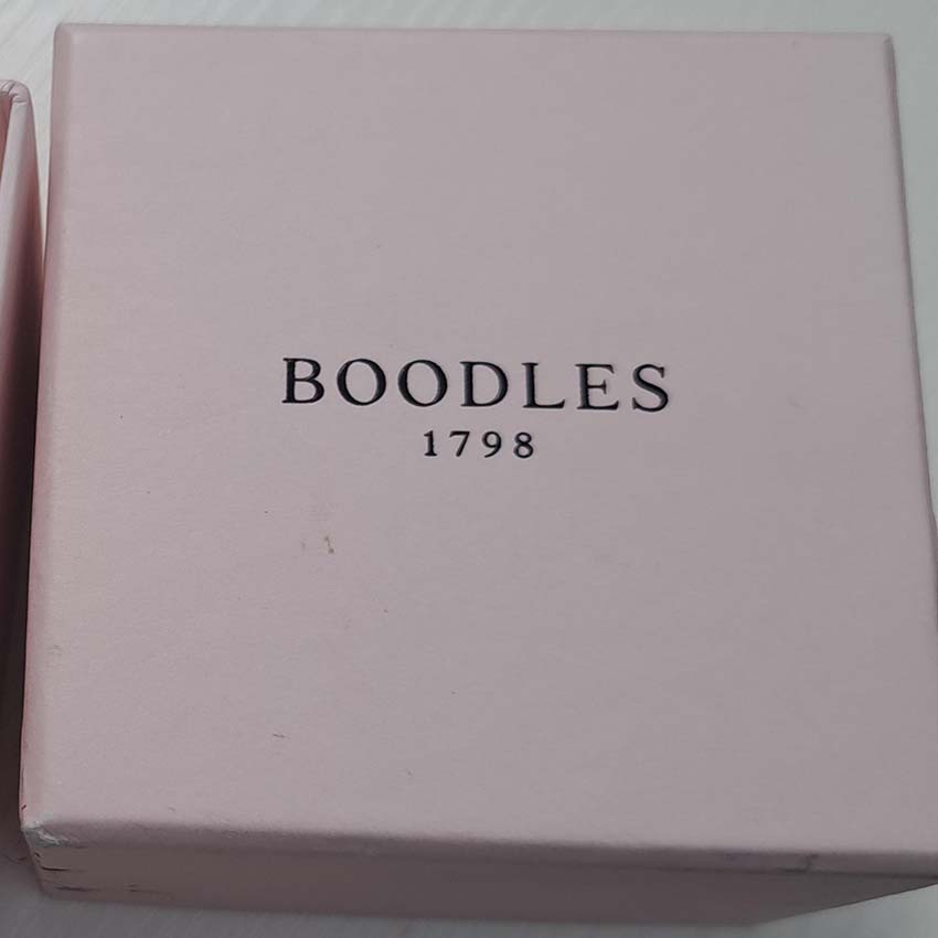 Boodles Waterfall Diamond Ring Classic Platinum, Inspired by the Raindance ring, the Waterfall ring features the iconic arrangement of diamond 'droplets' in an asymmetrical design over three bands which are then further accented with being set with smaller diamonds throughout