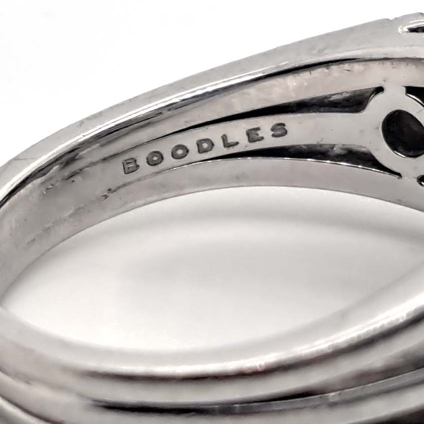 Boodles Waterfall Diamond Ring Classic Platinum, Inspired by the Raindance ring, the Waterfall ring features the iconic arrangement of diamond 'droplets' in an asymmetrical design over three bands which are then further accented with being set with smaller diamonds throughout