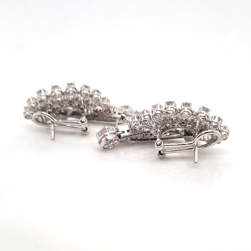 Carl Bucherer Vintage Diamond Spray Earrings in Platinum, set with sparkling brilliant, baguette and marquise-cut diamonds with post and clip fittings. Circa 1950s