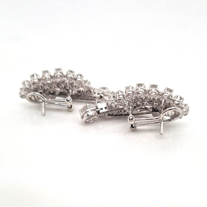 Carl Bucherer Vintage Diamond Spray Earrings in Platinum, set with sparkling brilliant, baguette and marquise-cut diamonds with post and clip fittings. Circa 1950s