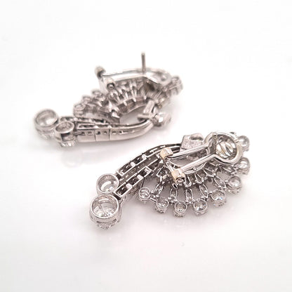 Carl Bucherer Vintage Diamond Spray Earrings in Platinum, set with sparkling brilliant, baguette and marquise-cut diamonds with post and clip fittings. Circa 1950s