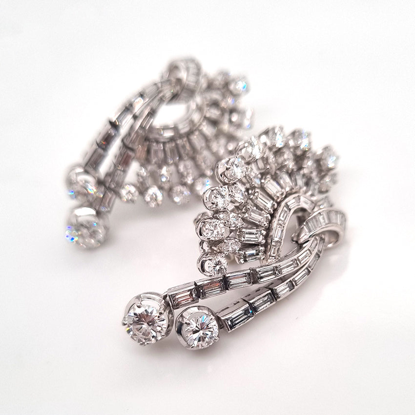 Carl Bucherer Vintage Diamond Spray Earrings in Platinum, set with sparkling brilliant, baguette and marquise-cut diamonds with post and clip fittings. Circa 1950s
