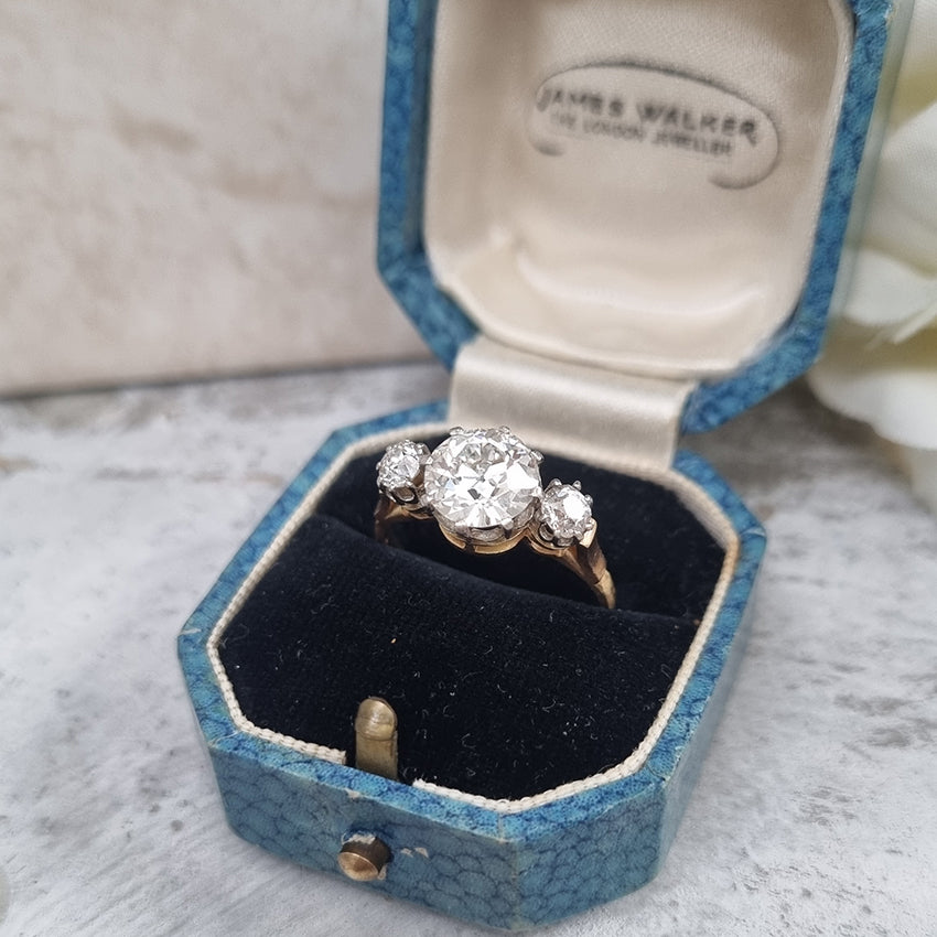 Art Deco French 1.81ct Old Cut Diamond Three Stone Engagement Ring, central 1.81ct F/G VS1 diamond flanked by smaller diamonds in platinum to 18ct yellow gold band