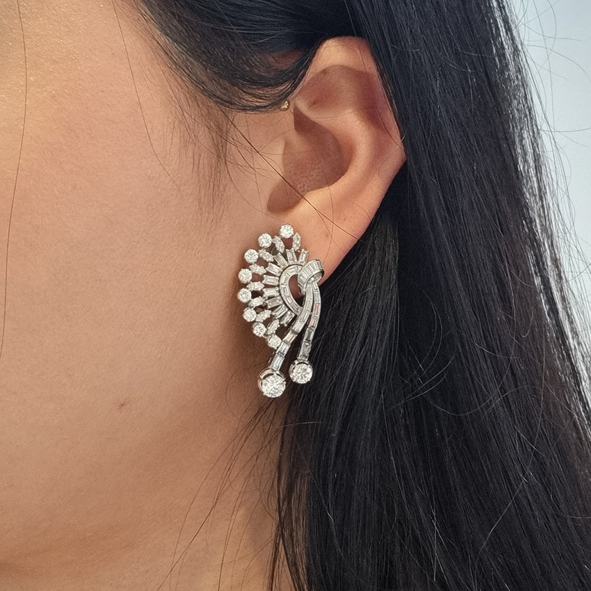 Carl Bucherer Vintage Diamond Spray Earrings in Platinum, set with sparkling brilliant, baguette and marquise-cut diamonds with post and clip fittings. Circa 1950s