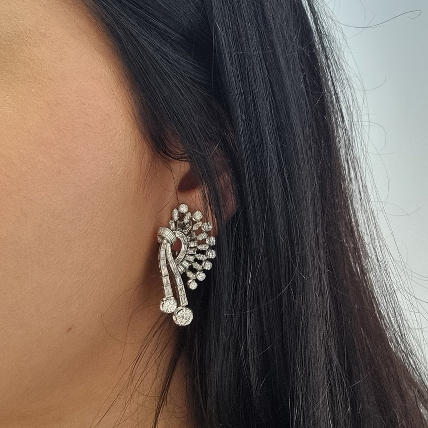 Carl Bucherer Vintage Diamond Spray Earrings in Platinum, set with sparkling brilliant, baguette and marquise-cut diamonds with post and clip fittings. Circa 1950s