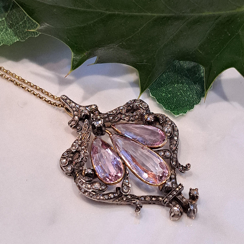 Antique Pink Topaz and Diamond Pendant Necklace, three teardrop pear shaped pink topaz within rose-cut diamond set surround in silver upon 18ct gold