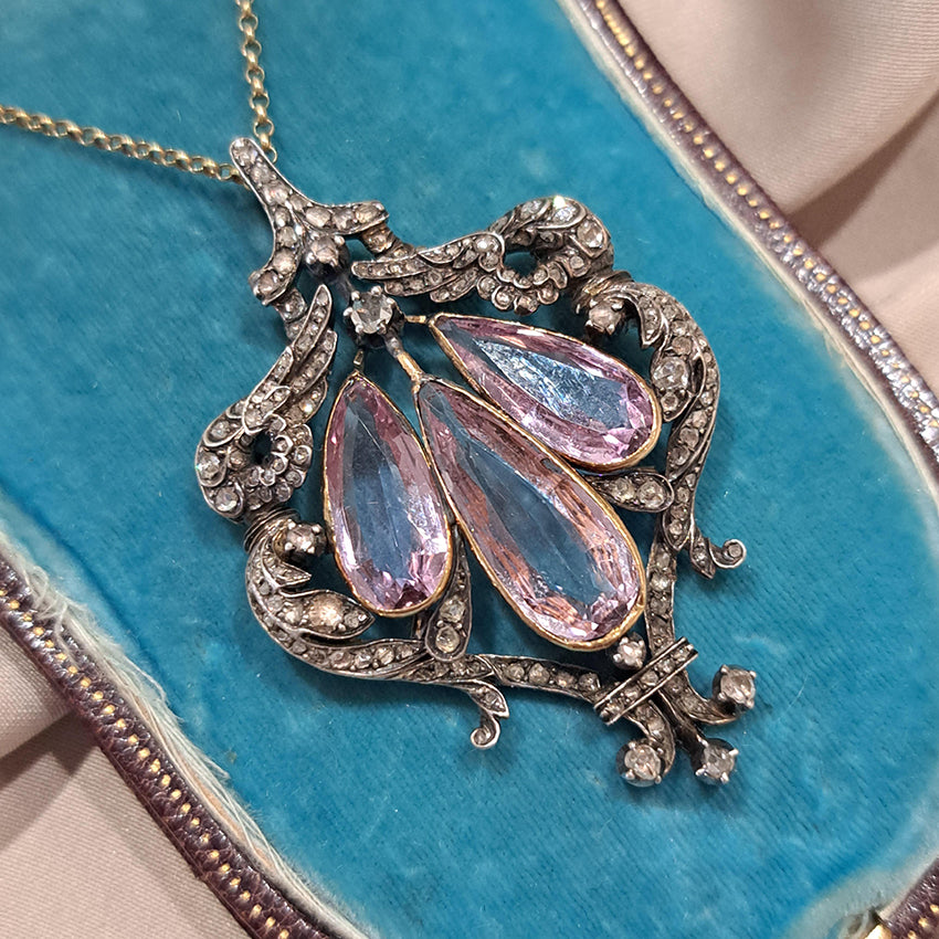 Antique Pink Topaz and Diamond Pendant Necklace, three teardrop pear shaped pink topaz within rose-cut diamond set surround in silver upon 18ct gold
