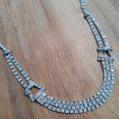 Antique Art Deco 7.64ct Diamond Collar Necklace in Platinum, single-cut and eight-cut diamonds in individual square articulated settings with central three row section graduated to a two row and single row of diamonds with geometric buckle shaped link sections