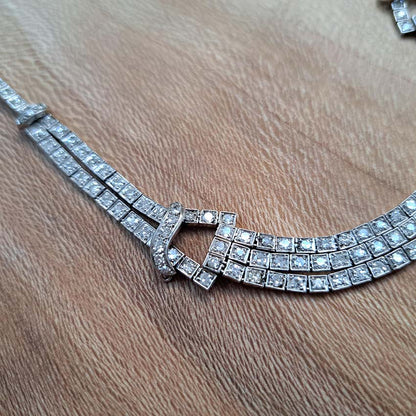 Antique Art Deco 7.64ct Diamond Collar Necklace in Platinum, single-cut and eight-cut diamonds in individual square articulated settings with central three row section graduated to a two row and single row of diamonds with geometric buckle shaped link sections