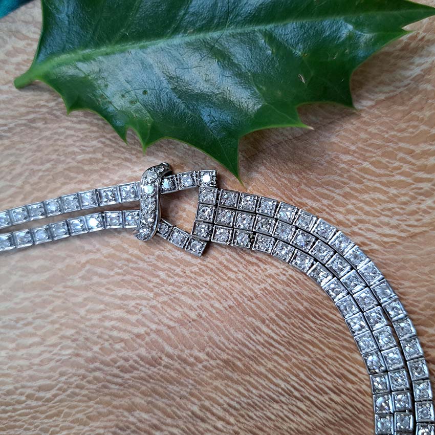 Antique Art Deco 7.64ct Diamond Collar Necklace in Platinum, single-cut and eight-cut diamonds in individual square articulated settings with central three row section graduated to a two row and single row of diamonds with geometric buckle shaped link sections