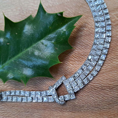 Antique Art Deco 7.64ct Diamond Collar Necklace in Platinum, single-cut and eight-cut diamonds in individual square articulated settings with central three row section graduated to a two row and single row of diamonds with geometric buckle shaped link sections
