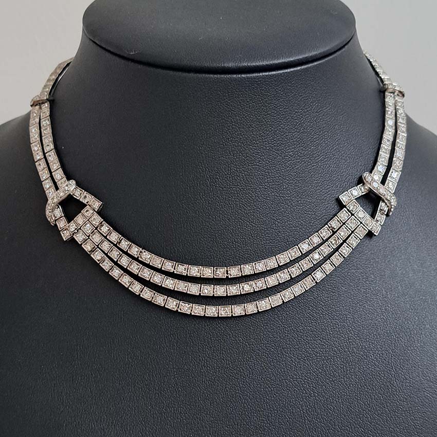 Antique Art Deco 7.64ct Diamond Collar Necklace in Platinum, single-cut and eight-cut diamonds in individual square articulated settings with central three row section graduated to a two row and single row of diamonds with geometric buckle shaped link sections
