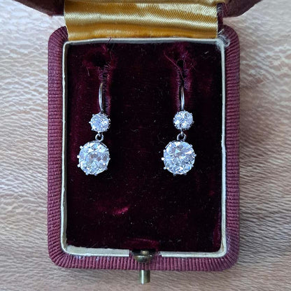 Antique 4.5ct Old Mine Cut Diamond Drop Earrings, sparkling old mine-cut diamond drops suspended from smaller old-cut diamond tops in platinum and 18ct gold