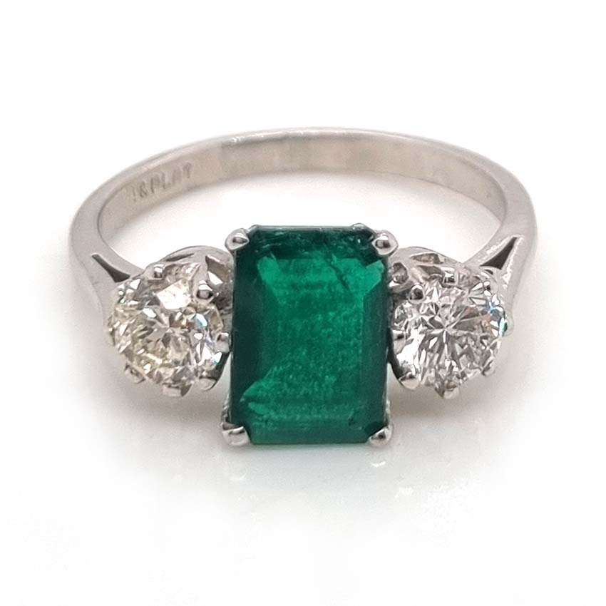 Emerald Cut Emerald and Diamond Three Stone Ring in 18ct White Gold