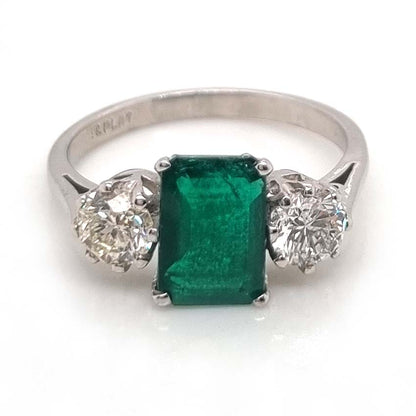 Emerald Cut Emerald and Diamond Three Stone Ring in 18ct White Gold