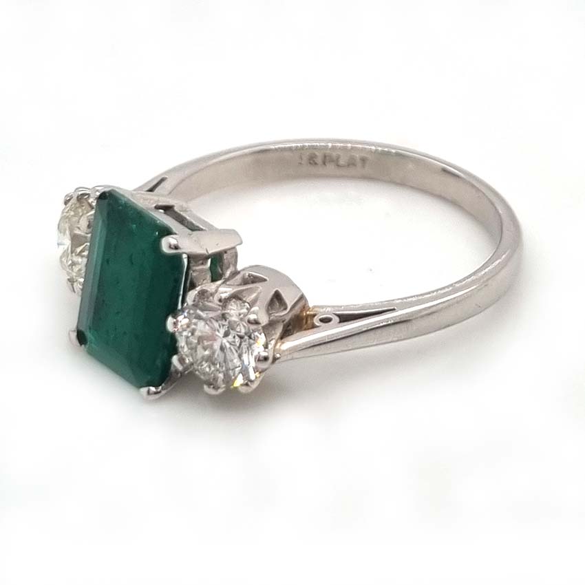Emerald Cut Emerald and Diamond Three Stone Ring in 18ct White Gold