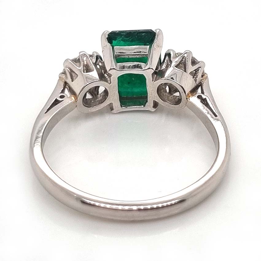 Emerald Cut Emerald and Diamond Three Stone Ring in 18ct White Gold