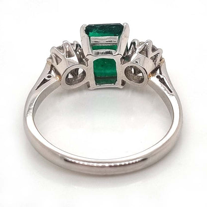 Emerald Cut Emerald and Diamond Three Stone Ring in 18ct White Gold