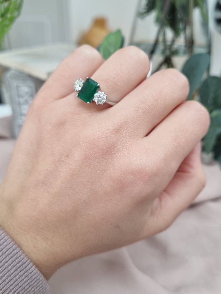 Emerald Cut Emerald and Diamond Three Stone Ring in 18ct White Gold