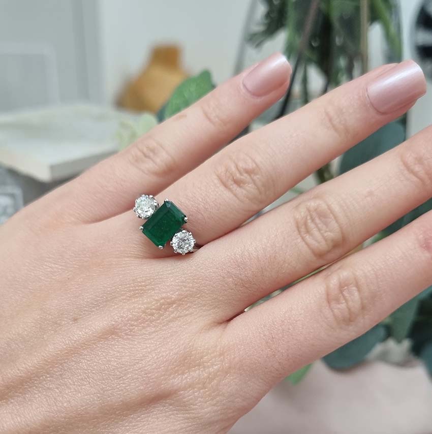 Emerald Cut Emerald and Diamond Three Stone Ring in 18ct White Gold