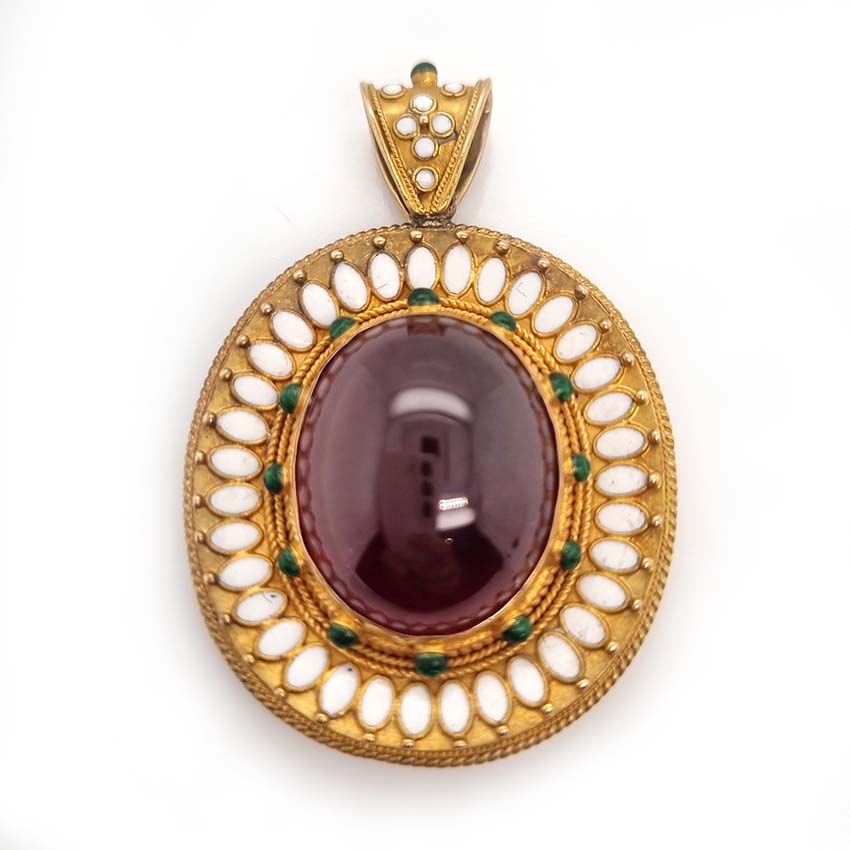 Antique Archaeological Revival Garnet Enamel and Gold Pendant, yellow gold pendant with large oval cabochon-cut garnet accented with white enamel and green enamel decorated surround