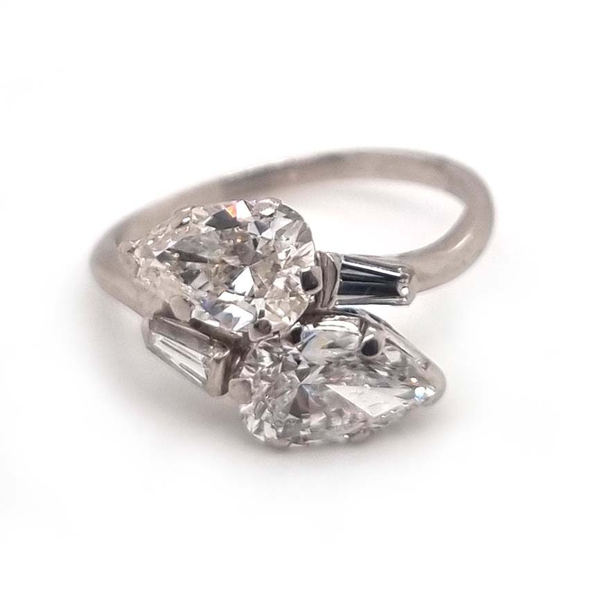 Art Deco Pear Diamond Toi et Moi Crossover Engagement Ring in Platinum, antique diamond two stone ring, Two pear-shaped diamonds lead to tapered baguette diamonds