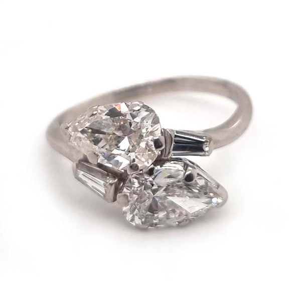 Art Deco Pear Diamond Toi et Moi Crossover Engagement Ring in Platinum, antique diamond two stone ring, Two pear-shaped diamonds lead to tapered baguette diamonds