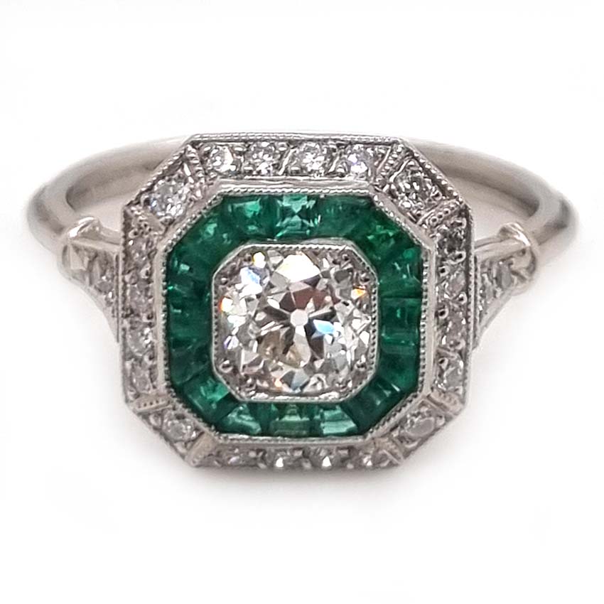 Old Cut Diamond and Emerald Target Cluster Engagement Ring, 0.55ct old cut diamond surrounded by calibre emeralds and an outer row of diamonds in platinum