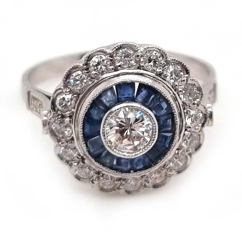 Diamond and Sapphire Target Cluster Engagement Ring in Platinum, central diamond surrounded by calibre sapphires and outer row of diamonds