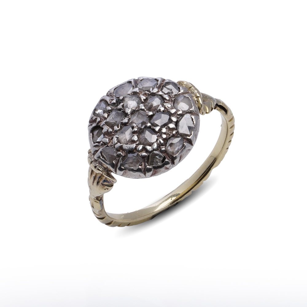 Victorian diamond cluster ring in gold and silver.