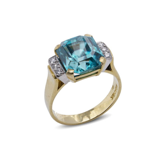 Blue zircon and diamond ring in gold.