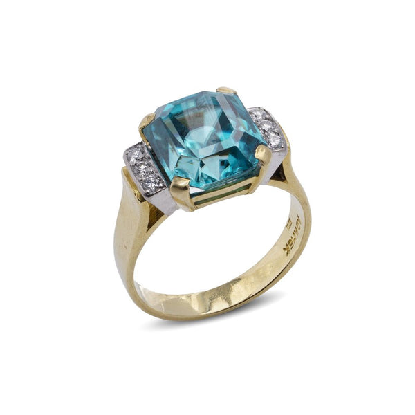 Blue zircon and diamond ring in gold.