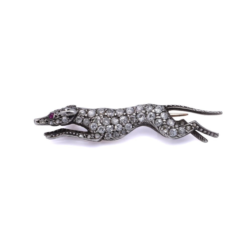 Antique gold and silver greyhound brooch with diamonds and ruby.