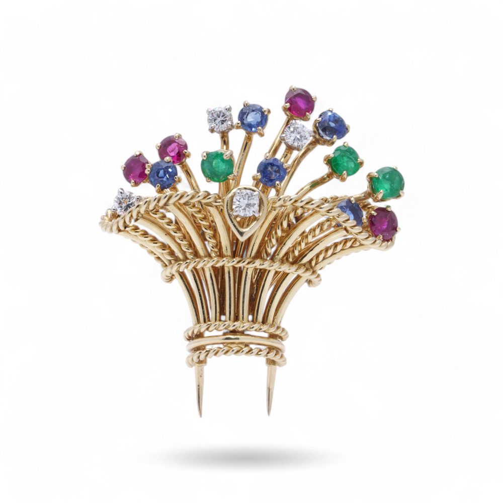 Cartier vintage flower basket brooch with gemstones in gold.