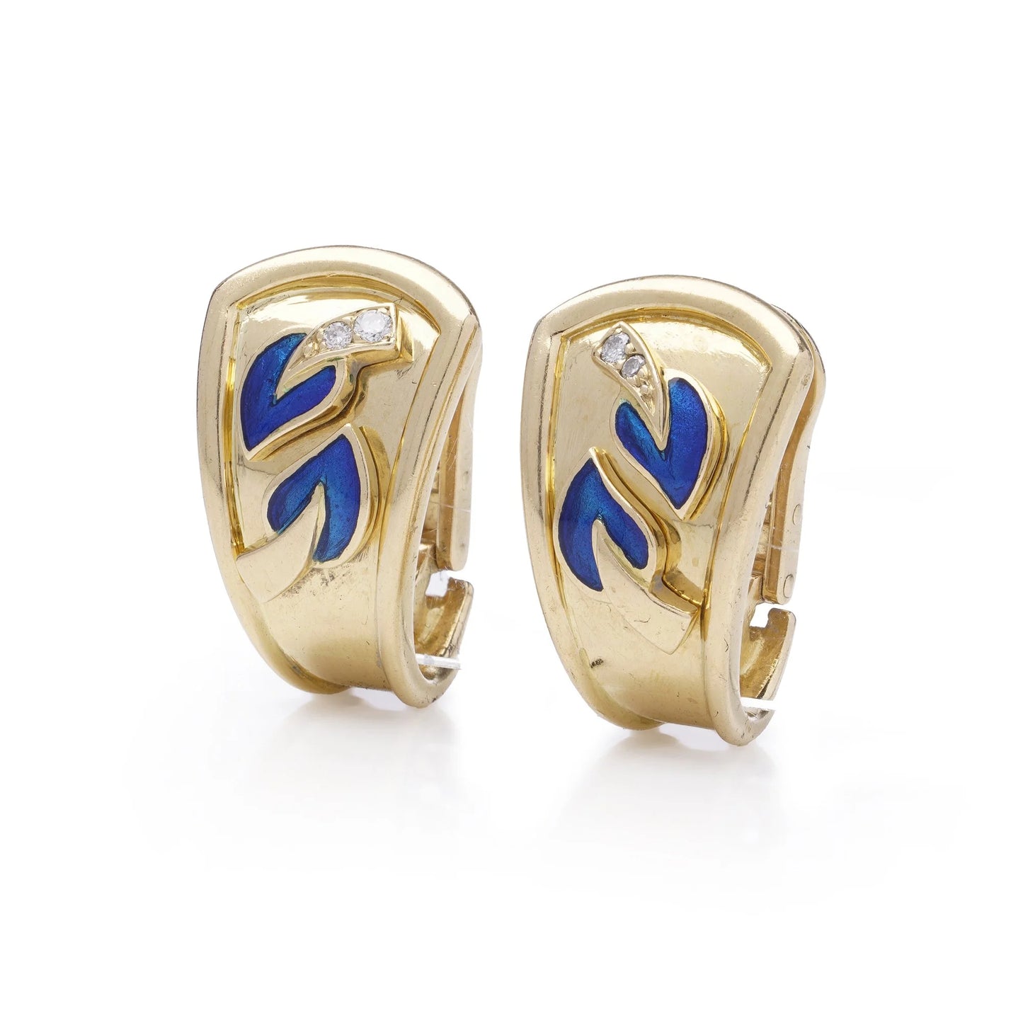 A pair of yellow gold earrings with blue enamel leaves and round diamonds, on a white background